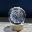 Laser-carved crystal ball with a lunar design and LED night light 